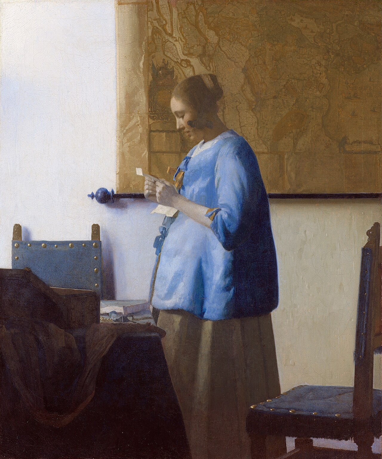 Woman in Blue Reading a Letter, c. 1663